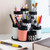 A lifestyle image of a decoupage pencil and brush caddy made with Mod Podge.
