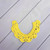 An image of a necklace made with Needle Crafters Acrylic Yarn, Sunny Yellow.