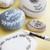 A lifestyle image of Posca PC-1M Extra-Fine Tip Paint Markers in use on stones.