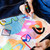 A lifestyle image of Posca PC-8K Broad Tip Paint Markers in use on denim.