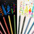 An image of Prismacolor Premier Colored Pencils on white and black paper.