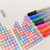 A lifestyle image of Sakura Gelly Roll Classic Gel Pens in use.