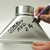 A close image of a Sakura Solid Marker in use on metal.