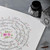 A lifestyle image of Speedball Super Black India Ink in use.